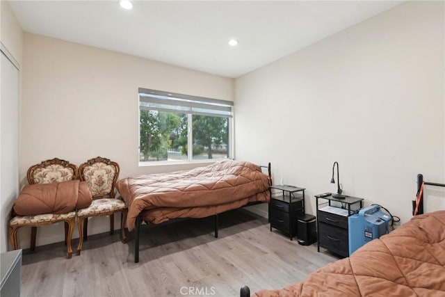 bedroom with light wood-type flooring