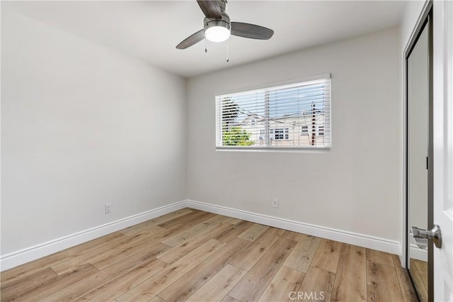 unfurnished bedroom with light wood-type flooring and ceiling fan