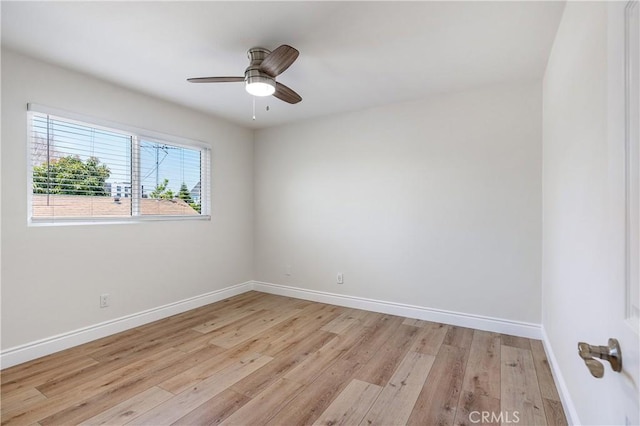 spare room with ceiling fan and light hardwood / wood-style floors