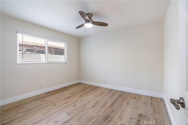 spare room featuring ceiling fan and light hardwood / wood-style flooring