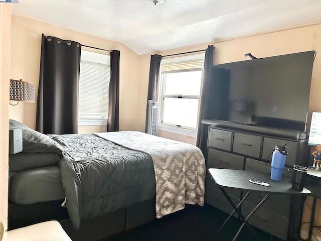 bedroom with vaulted ceiling