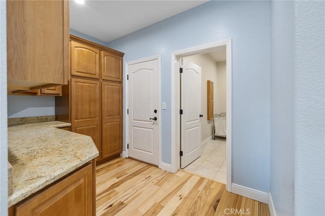 hall with light hardwood / wood-style flooring