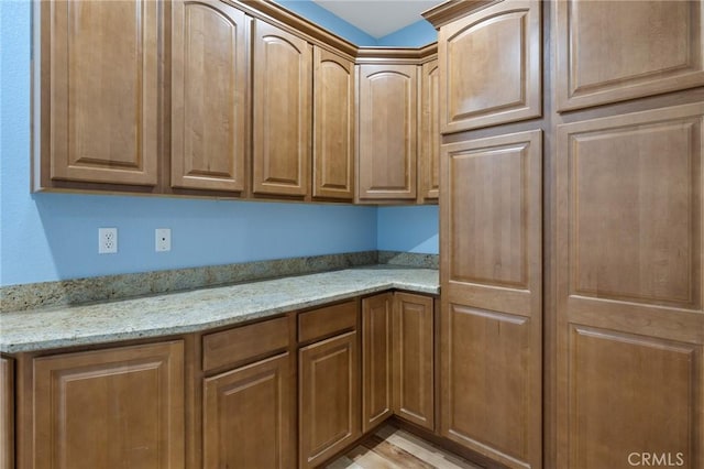 kitchen featuring light stone counters