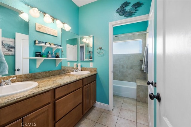 bathroom with vanity, tile patterned floors, and tiled shower / bath