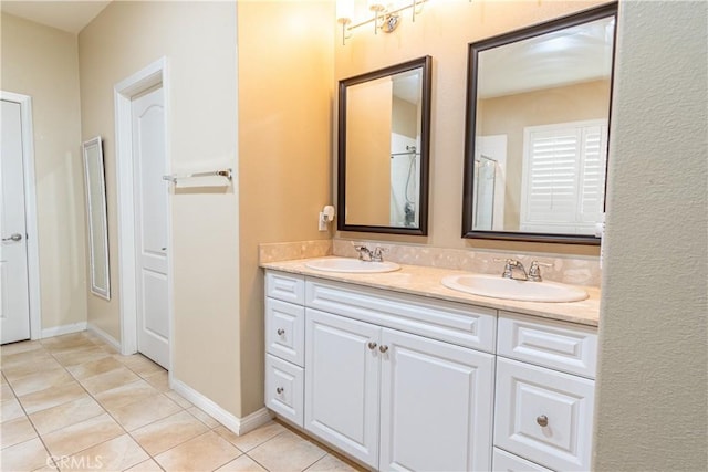 bathroom with vanity and tile patterned flooring