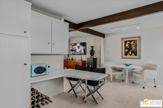 tiled office featuring beamed ceiling