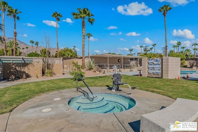 view of pool featuring a lawn