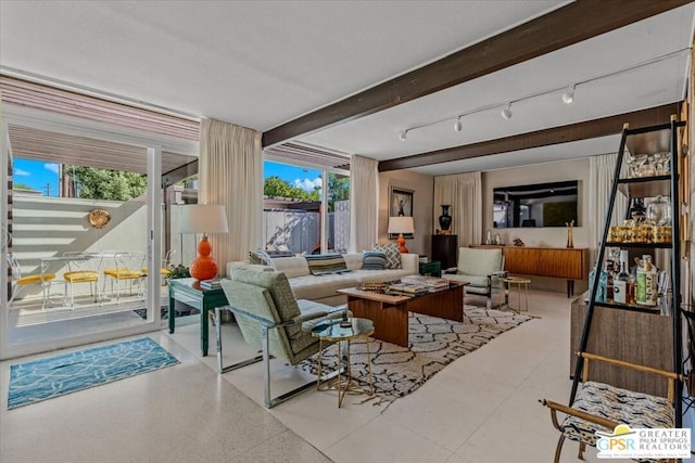 living room featuring beam ceiling