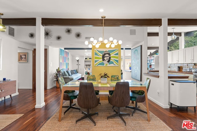 dining area featuring dark hardwood / wood-style flooring and a chandelier