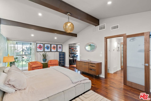 bedroom with a walk in closet, lofted ceiling with beams, and dark hardwood / wood-style flooring