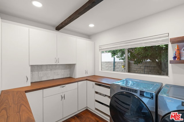 laundry area featuring cabinets, washer and clothes dryer, and dark wood-type flooring