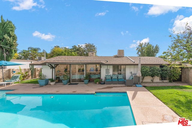 view of pool featuring a patio, a yard, and outdoor lounge area