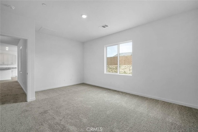 spare room with carpet flooring