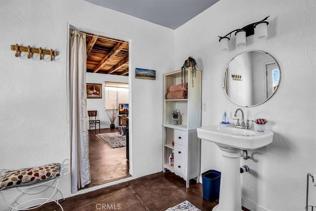 bathroom featuring concrete floors and sink