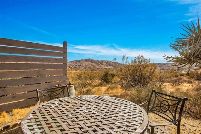 view of patio / terrace with a mountain view