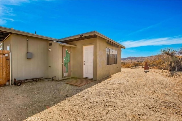 rear view of property with a mountain view