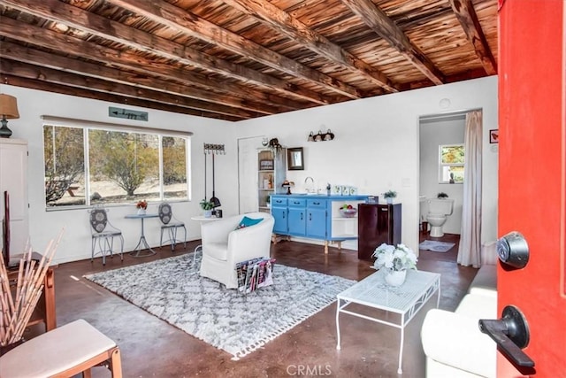 living room featuring wooden ceiling and beamed ceiling