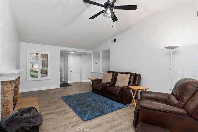 living room featuring lofted ceiling, ceiling fan, and hardwood / wood-style floors