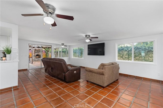 tiled living room featuring a fireplace