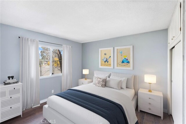 bedroom featuring dark wood-type flooring