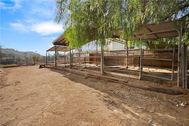 view of yard featuring an outbuilding and a rural view