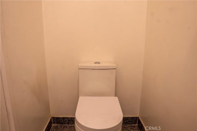 bathroom featuring toilet