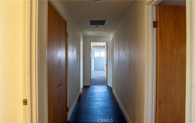 hallway with dark hardwood / wood-style floors