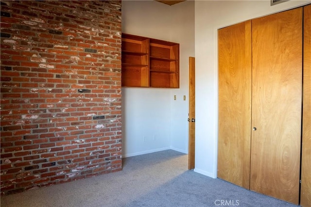 interior space featuring a closet and carpet flooring