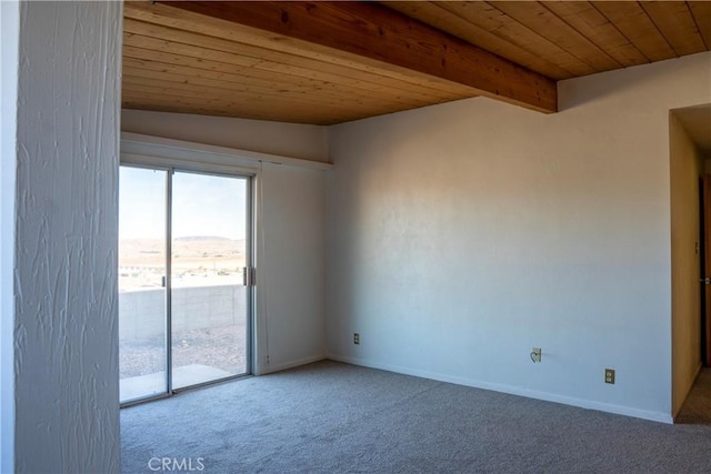 carpeted empty room with lofted ceiling with beams and wood ceiling