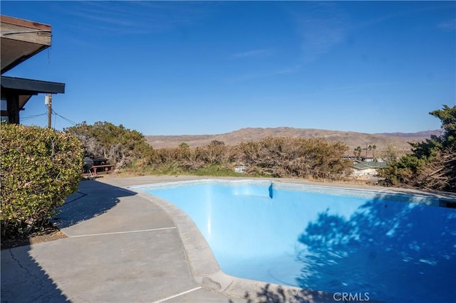 view of pool featuring a mountain view