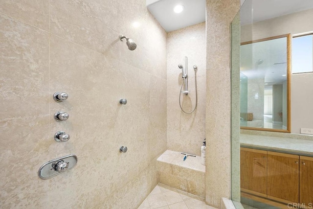 bathroom featuring tile patterned floors and tiled shower