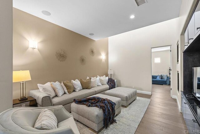 living room with light hardwood / wood-style flooring