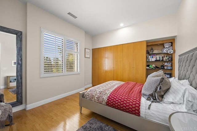 bedroom featuring wood-type flooring