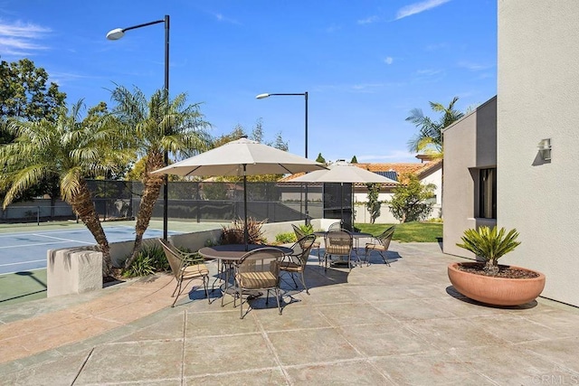 view of patio / terrace featuring tennis court