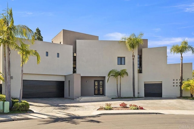 view of front facade with french doors and a garage