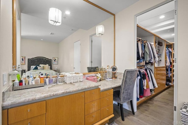 interior space with wood-type flooring and vanity