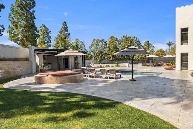exterior space featuring a yard, fence, a hot tub, a swimming pool, and a patio area