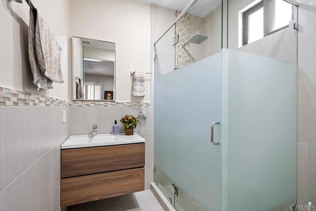 1107 Majestad Ln, Chula Vista, CA 91910 - bathroom with tile walls, a shower stall, and vanity