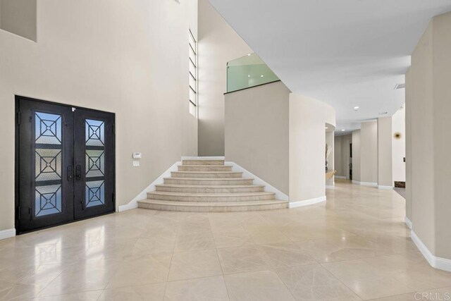 1107 Majestad Ln, Chula Vista, CA 91910 - entrance foyer featuring baseboards, stairs, and french doors