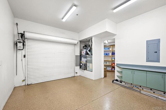 1107 Majestad Ln, Chula Vista, CA 91910 - garage featuring secured water heater, electric panel, and baseboards
