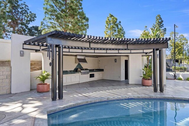 1107 Majestad Ln, Chula Vista, CA 91910 - view of swimming pool featuring a fenced in pool, a patio, a grill, exterior kitchen, and a pergola