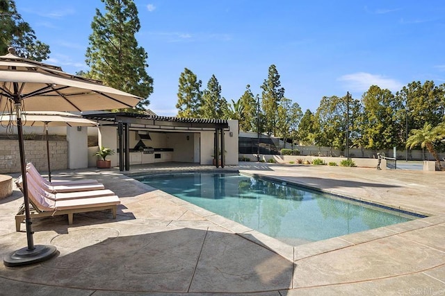 view of pool with a patio, fence, a fenced in pool, and a pergola