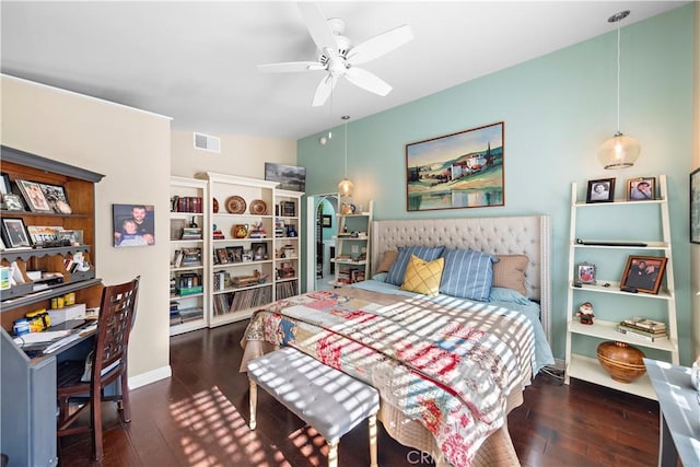 bedroom with ceiling fan and dark hardwood / wood-style flooring