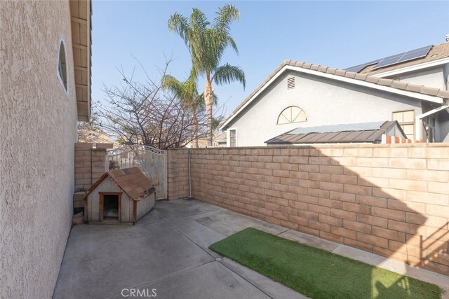 view of patio with a storage unit