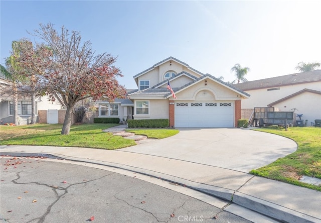 view of property featuring a front yard and a garage