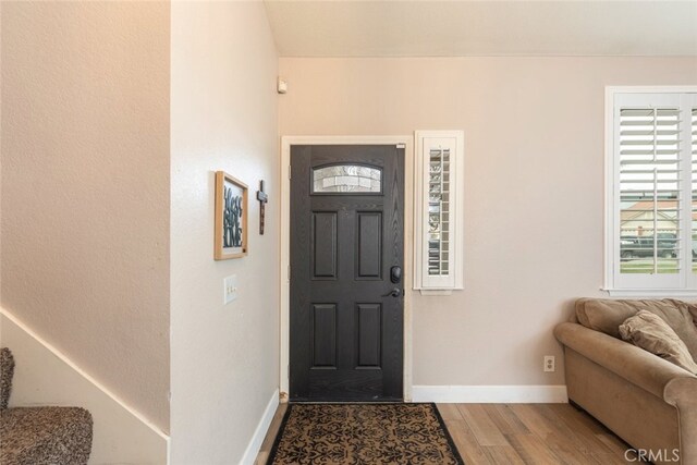 foyer entrance with light hardwood / wood-style floors