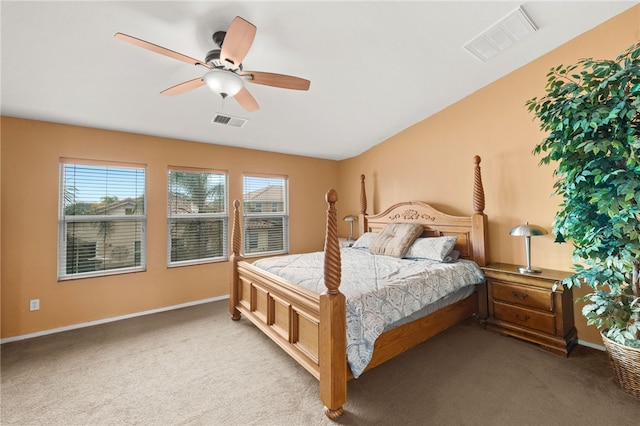 bedroom with ceiling fan and light colored carpet