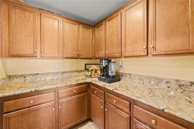 kitchen with light stone countertops