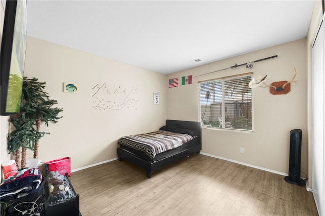 bedroom featuring light wood-type flooring