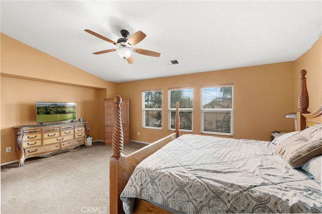 bedroom with ceiling fan, carpet, and vaulted ceiling